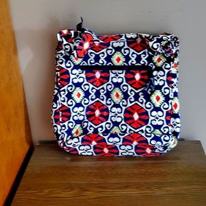 A Vera Bradly Shoulder bag. Colors are mainly orange, white, green and dark blue